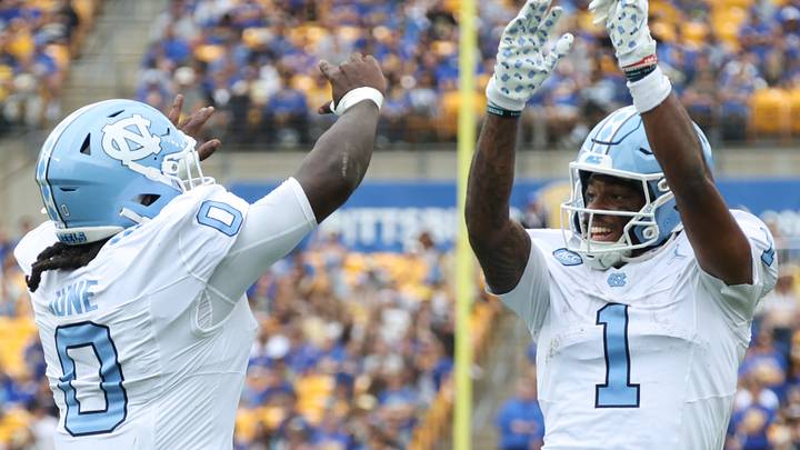 Oct 10, 2026; Pittsburgh, Pennsylvania, USA;  North Carolina Tar Heels running back Demon June (0) celebrates his touchdown with wide receiver Jordan Shipp (1) against the Pittsburgh Panthers during the third quarter at Acrisure Stadium.  Mandatory Credit: Charles LeClaire-Imagn Images