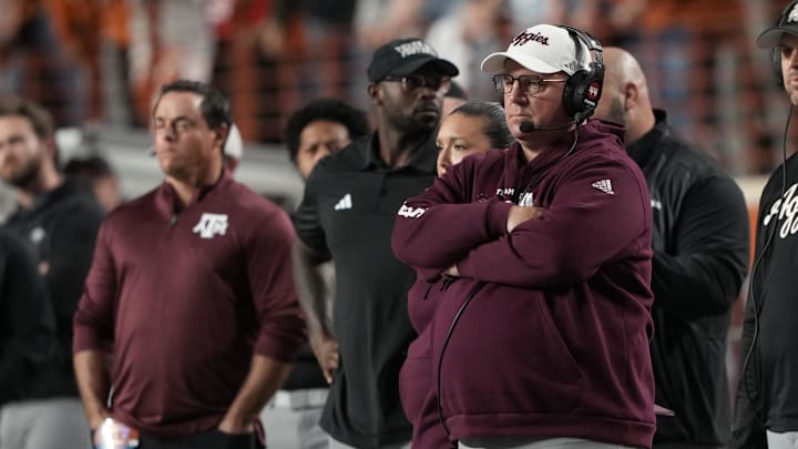 Head coach Mike Elko watches the first half of play against the Texas Longhorns at Darrell K Royal-Texas Memorial Stadium.
