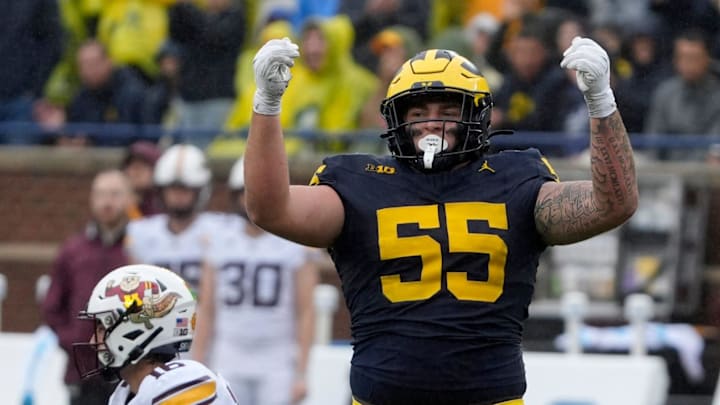 Michigan defensive lineman Mason Graham celebrates after sacking Minnesota quarterback Max Brosmer, in the background, during first-half action between Michigan and Minnesota at Michigan Stadium in Ann Arbor on Saturday, Sept. 28, 2024. Michigan defensive lineman Mason Graham celebrates after sacking Minnesota quarterback Max Brosmer, in the background, during first-half action between Michigan and Minnesota at Michigan Stadium in Ann Arbor on Saturday, Sept. 28, 2024.