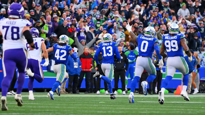 Nov 30, 2025; Seattle, Washington, USA; Seattle Seahawks linebacker Ernest Jones IV (13) runs back for an interception during the first half against the Minnesota Vikings at Lumen Field. Nov 30, 2025; Seattle, Washington, USA; Seattle Seahawks linebacker Ernest Jones IV (13) runs back for an interception during the first half against the Minnesota Vikings at Lumen Field.