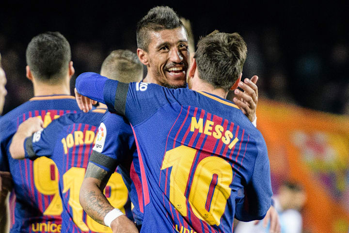 Paulinho and Lionel Messi for Barcelona.