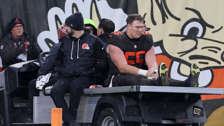 Dec 7, 2025; Cleveland, Ohio, USA; Cleveland Browns center Ethan Pocic (55) leaves the field on a cart after suffering an apparent injury against the Tennessee Titans during the fourth quarter at Huntington Bank Field. Mandatory Credit: Scott Galvin-Imagn Images