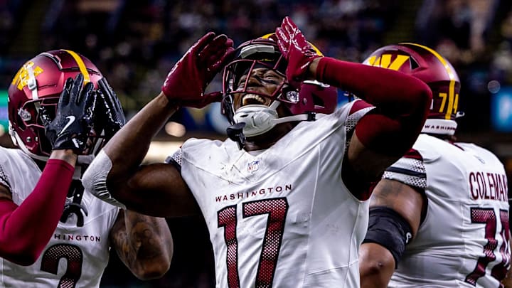 Dec 15, 2024; New Orleans, Louisiana, USA;  Washington Commanders wide receiver Terry McLaurin (17) reacts to scoring a touchdown against the New Orleans Saints during the first half at Caesars Superdome. Mandatory Credit: Stephen Lew-Imagn Images