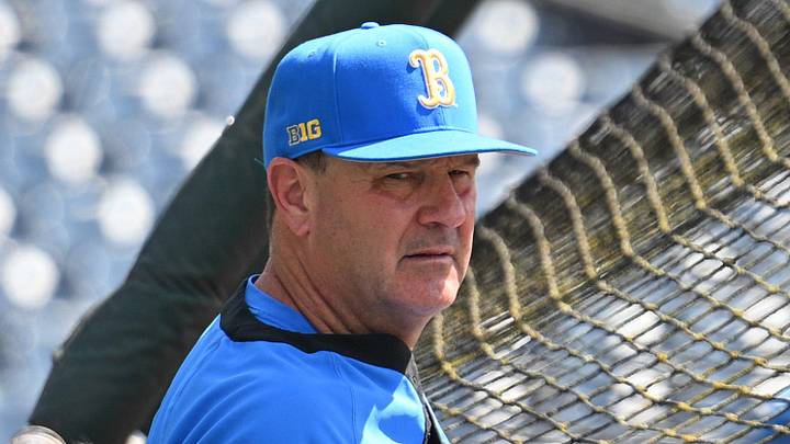 Jun 14, 2025; Omaha, Neb, USA; UCLA Bruins head coach John Savage watches the team warm up before the game against the Murray State Races at Charles Schwab Field. Mandatory Credit: Steven Branscombe-Imagn Images Jun 14, 2025; Omaha, Neb, USA; UCLA Bruins head coach John Savage watches the team warm up before the game against the Murray State Races at Charles Schwab Field. Mandatory Credit: Steven Branscombe-Imagn Images