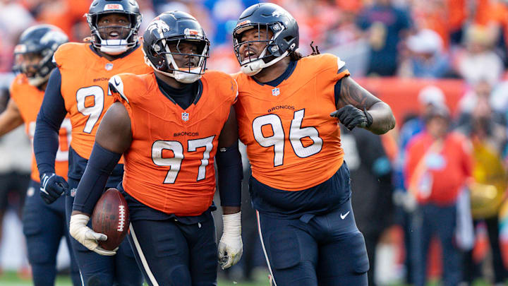 October 13, 2024: Denver Broncos defensive tackle Malcolm Roach (97) celebrates his fumble recovery with teammate Denver Broncos defensive end Eyioma Uwazurike (96) in the second half of the football game between the Denver Broncos and Los Angeles Chargers. The play was wiped out by a defensive holding call. 