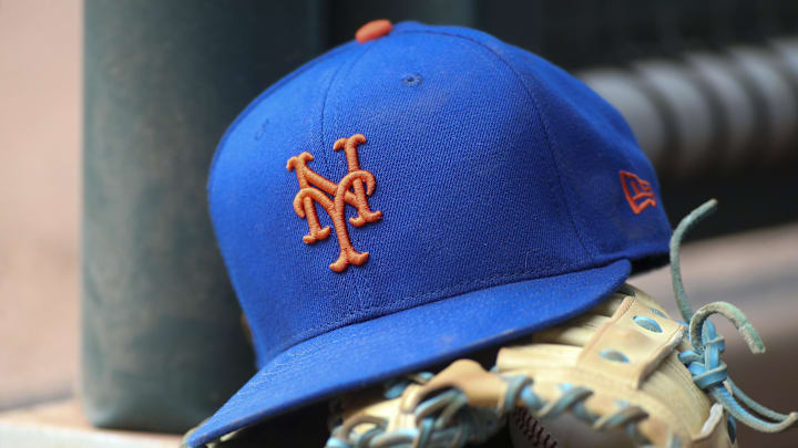 Jul 13, 2022; Atlanta, Georgia, USA; A detailed view of a New York Mets hat and glove in the dugout against the Atlanta Braves in the eighth inning at Truist Park. Jul 13, 2022; Atlanta, Georgia, USA; A detailed view of a New York Mets hat and glove in the dugout against the Atlanta Braves in the eighth inning at Truist Park.