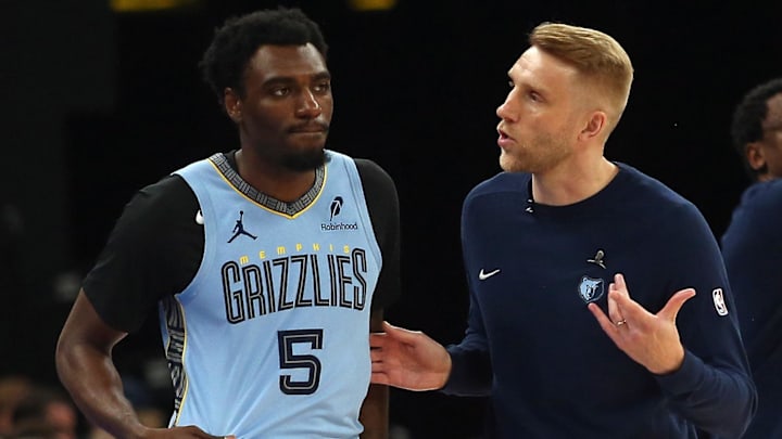 Mar 31, 2025; Memphis, Tennessee, USA; Memphis Grizzlies interim head coach Tuomas Iisalo (right) talks with Memphis Grizzlies guard Vince Williams Jr. (5) during the first quarter at FedExForum. Mandatory Credit: Petre Thomas-Imagn Images Mar 31, 2025; Memphis, Tennessee, USA; Memphis Grizzlies interim head coach Tuomas Iisalo (right) talks with Memphis Grizzlies guard Vince Williams Jr. (5) during the first quarter at FedExForum. Mandatory Credit: Petre Thomas-Imagn Images