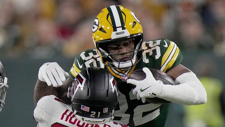 Green Bay Packers running back MarShawn Lloyd (32) is tackled by Atlanta Falcons cornerback Mike Hughes. Green Bay Packers running back MarShawn Lloyd (32) is tackled by Atlanta Falcons cornerback Mike Hughes.