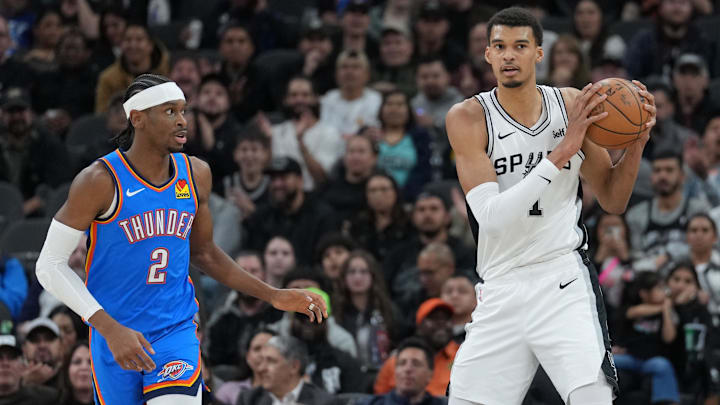 Feb 29, 2024; San Antonio, Texas, USA;  San Antonio Spurs center Victor Wembanyama (1) looks down the court beside Oklahoma City Thunder guard Shai Gilgeous-Alexander (2) in the first half at Frost Bank Center. Mandatory Credit: Daniel Dunn-Imagn Images