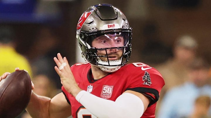 Nov 23, 2025; Inglewood, California, USA; Tampa Bay Buccaneers quarterback Baker Mayfield (6) looks to pass the ball while running outside the pocket against the Los Angeles Rams during the first quarter at SoFi Stadium. Mandatory Credit: Kiyoshi Mio-Imagn Images