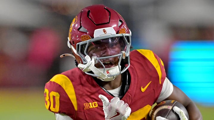 Oct 11, 2025; Los Angeles, California, USA; USC Trojans running back King Miller (30) runs for a touchdown in the second half against the Michigan Wolverines at United Airlines Field at the Los Angeles Memorial Coliseum. Mandatory Credit: Jayne Kamin-Oncea-Imagn Images Oct 11, 2025; Los Angeles, California, USA; USC Trojans running back King Miller (30) runs for a touchdown in the second half against the Michigan Wolverines at United Airlines Field at the Los Angeles Memorial Coliseum. Mandatory Credit: Jayne Kamin-Oncea-Imagn Images