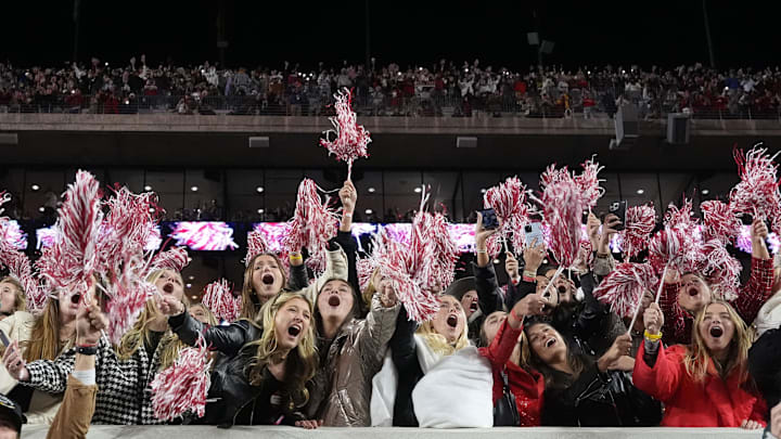 Nov 30, 2024; Tuscaloosa, Alabama, USA;  Alabmaa fans yell in joy during the second half against the Auburn Tigers at Bryant-Denny Stadium. Alabama won 28-14. Mandatory Credit: Gary Cosby Jr.-Imagn Images