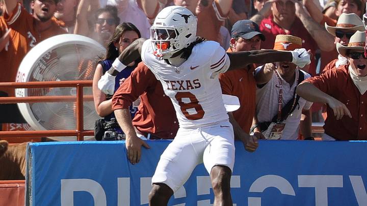 Texas Longhorns wide receiver Cam Coleman celebrates after scoring a touchdown against the Oklahoma Sooners. Texas Longhorns wide receiver Cam Coleman celebrates after scoring a touchdown against the Oklahoma Sooners.