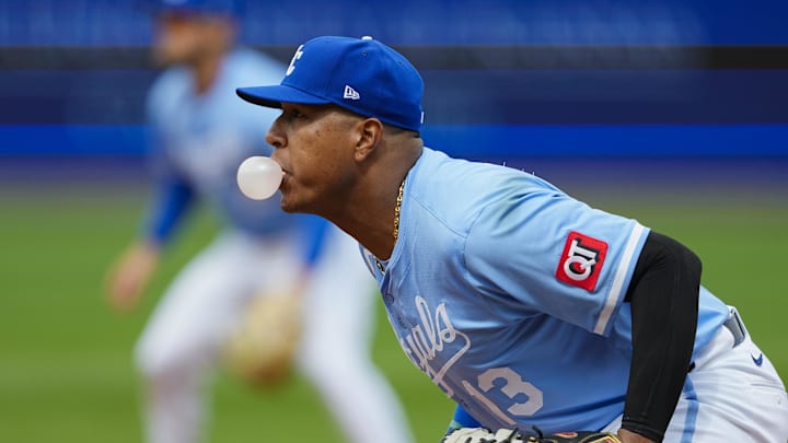 Mar 30, 2025; Kansas City, Missouri, USA; Kansas City Royals first baseman Salvador Perez (13) blows a bubble while defending during the fifth inning against the Cleveland Guardians at Kauffman Stadium. Mandatory Credit: Jay Biggerstaff-Imagn Images