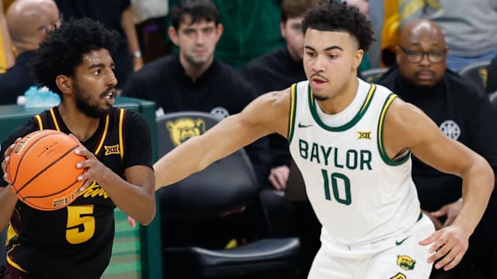 Feb 21, 2026; Waco, Texas, USA; Arizona State Sun Devils guard Maurice Odum (5) looks to pass against Baylor Bears guard Isaac Williams (10) during the second half at Paul and Alejandra Foster Pavilion. Mandatory Credit: Chris Jones-Imagn Images