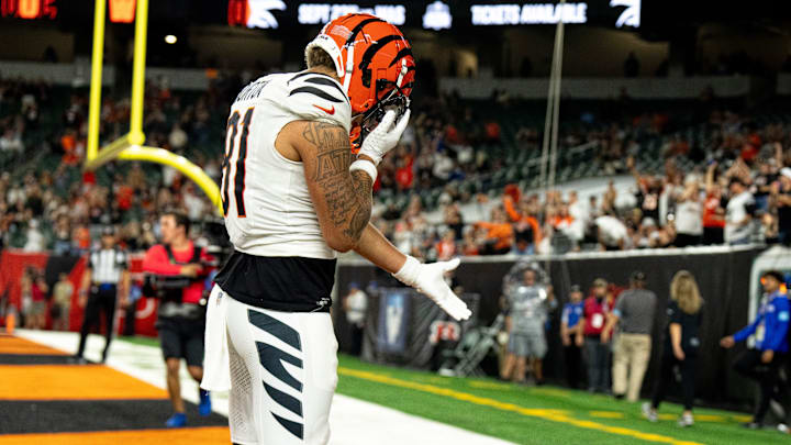 Cincinnati Bengals wide receiver Jermaine Burton (81) drops the ball on the ground after catching a touchdown pass in the fourth quarter of the NFL preseason game between the Cincinnati Bengals and the Indianapolis Colts at Paycor Stadium in Cincinnati on Thursday, Aug. 22, 2024.