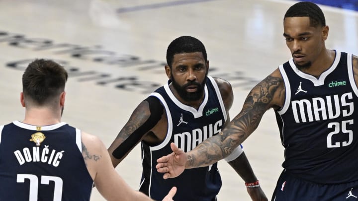 Jun 12, 2024; Dallas, Texas, USA; Dallas Mavericks guard Kyrie Irving (11) and forward P.J. Washington (25) celebrate with guard Luka Doncic (77) after a play during the fourth quarter in game three of the 2024 NBA Finals against the Boston Celtics at American Airlines Center. Mandatory Credit: Jerome Miron-USA TODAY Sports