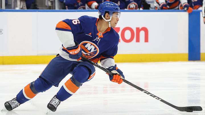 Dec 23, 2024; Elmont, New York, USA;  New York Islanders defenseman Isaiah George (36) controls the puck in the third period against the Buffalo Sabres at UBS Arena. Mandatory Credit: Wendell Cruz-Imagn Images