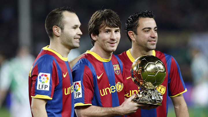 Andres Iniesta (left) Lionel Messi (middle) and Xavi Hernández made history in 2010, as for the first time ever the Ballon d'Or podium was made up of three players from the same team.