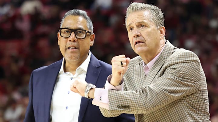 Arkansas Razorbacks assistant coach Chuck Martin looks on as coach John Calipari reacts to a non call in the second half against the Troy Trojans at Bud Walton Arena in Fayetteville, Ark.