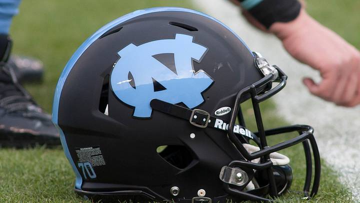 Dec 28, 2013; Charlotte, NC, USA; A North Carolina Tar Heels helmet lays on the field prior to the start of the game against the Cincinnati Bearcats in the Belk Bowl at Bank of America Stadium. Mandatory Credit: Jeremy Brevard-USA TODAY Sports Dec 28, 2013; Charlotte, NC, USA; A North Carolina Tar Heels helmet lays on the field prior to the start of the game against the Cincinnati Bearcats in the Belk Bowl at Bank of America Stadium. Mandatory Credit: Jeremy Brevard-USA TODAY Sports