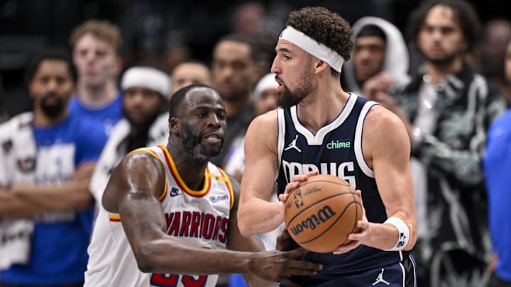 Feb 12, 2025; Dallas, Texas, USA; Golden State Warriors forward Draymond Green (23) and Dallas Mavericks guard Klay Thompson (31) in action during the game between the Dallas Mavericks and the Golden State Warriors at the American Airlines Center. Mandatory Credit: Jerome Miron-Imagn Images