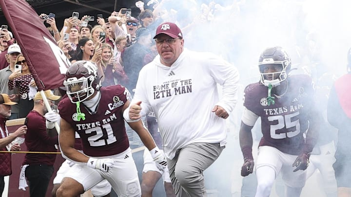 Texas A&M Aggies head coach Mike Elko takes the field prior to the game against the Miami Hurricanes during the first round of the CFP National Playoff at Kyle Field. 