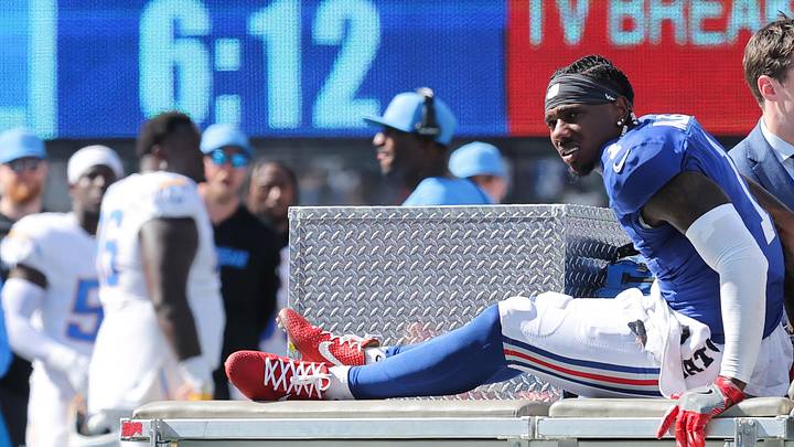 Sep 28, 2025; East Rutherford, New Jersey, USA; New York Giants wide receiver Malik Nabers (1) is carted off the field following an injury during the second quarter against the Los Angeles Chargers at MetLife Stadium. Mandatory Credit: Brad Penner-Imagn Images