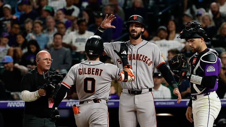 May 30, 2026; Denver, Colorado, USA; San Francisco Giants designated hitter Bryce Eldridge (8) celebrates the two run home run of center fielder Drew Gilbert (0) as Colorado Rockies catcher Brett Sullivan (26) looks on in the eighth inning at Coors Field. Mandatory Credit: Isaiah J. Downing-Imagn Images