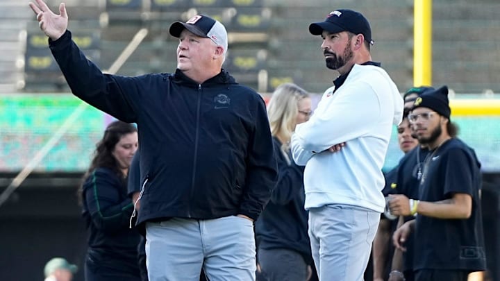 Oct 12, 2024; Eugene, Oregon, USA; Ohio State Buckeyes head coach Ryan Day talks to offensive coordinator Chip Kelly prior to the NCAA football game against the Oregon Ducks at Autzen Stadium