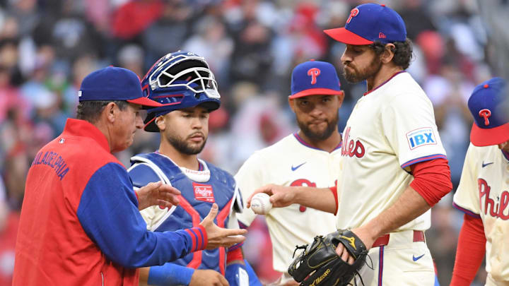 Apr 6, 2025; Philadelphia, Pennsylvania, USA; Philadelphia Phillies pitcher Jordan Romano (68) hands the ball to  manager Rob Thomson (59) after being removed from the game during the seventh inning against the Los Angeles Dodgers at Citizens Bank Park. 