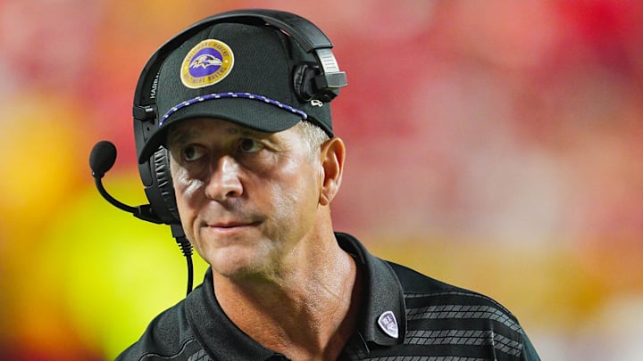 Sep 5, 2024; Kansas City, Missouri, USA; Baltimore Ravens head coach John Harbaugh talks with quarterback Lamar Jackson (8) during the second half against the Kansas City Chiefs at GEHA Field at Arrowhead Stadium. Mandatory Credit: Jay Biggerstaff-Imagn Images