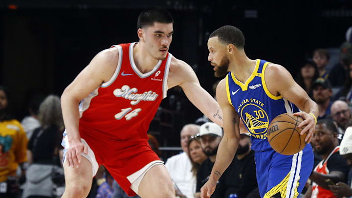 Apr 1, 2025; Memphis, Tennessee, USA; Golden State Warriors guard Stephen Curry (30) dribbles as Memphis Grizzlies center Zach Edey (14) defends during the first quarter at FedExForum. Mandatory Credit: Petre Thomas-Imagn Images Apr 1, 2025; Memphis, Tennessee, USA; Golden State Warriors guard Stephen Curry (30) dribbles as Memphis Grizzlies center Zach Edey (14) defends during the first quarter at FedExForum. Mandatory Credit: Petre Thomas-Imagn Images