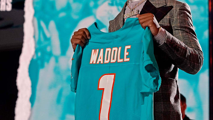Apr 29, 2021; Cleveland, Ohio, USA; Jaylen Waddle (Alabama) poses with a jersey after being selected