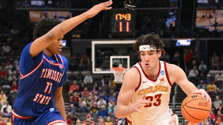 Mar 20, 2026; St. Louis, MO, USA; Iowa State Cyclones forward Blake Buchanan (23) drives to the basket against Tennessee State Tigers forward Antoine Lorick III (11) during the first half of a first round game of the men's 2026 NCAA Tournament at Enterprise Center.