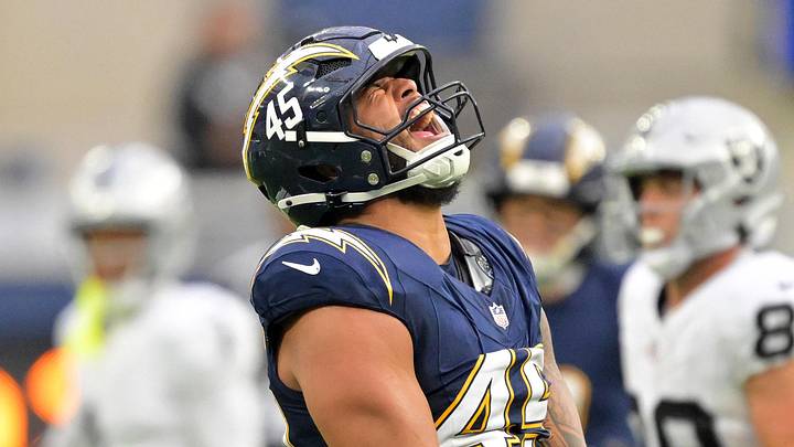 Nov 30, 2025; Inglewood, California, USA; Los Angeles Chargers linebacker Tuli Tuipulotu (45) reacts after a sack against the Las Vegas Raiders during the second half at SoFi Stadium. Mandatory Credit: Jayne Kamin-Oncea-Imagn Images
