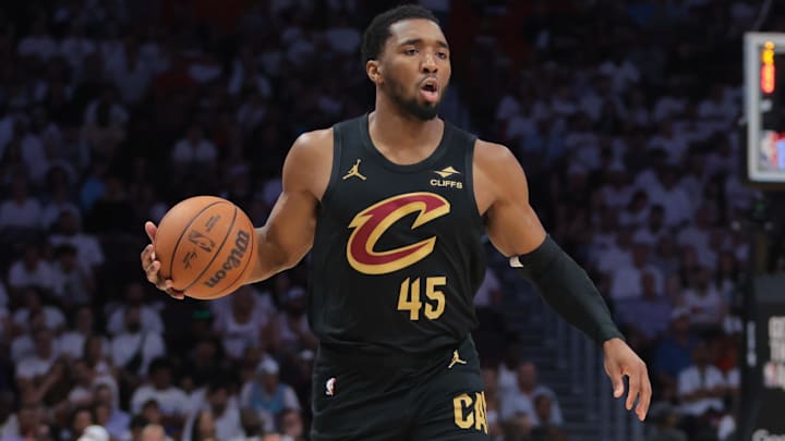 Apr 26, 2025; Miami, Florida, USA; Cleveland Cavaliers guard Donovan Mitchell (45) dribbles the basketball as Miami Heat forward Andrew Wiggins (22) defends in the first quarter during game three for the first round of the 2025 NBA Playoffs at Kaseya Center. Mandatory Credit: Sam Navarro-Imagn Images Apr 26, 2025; Miami, Florida, USA; Cleveland Cavaliers guard Donovan Mitchell (45) dribbles the basketball as Miami Heat forward Andrew Wiggins (22) defends in the first quarter during game three for the first round of the 2025 NBA Playoffs at Kaseya Center. Mandatory Credit: Sam Navarro-Imagn Images