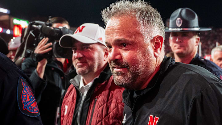 Nov 23, 2024; Lincoln, Nebraska, USA; Nebraska Cornhuskers head coach Matt Rhule and athletic director Troy Dannen walk off the field after defeating the Wisconsin Badgers at Memorial Stadium. 