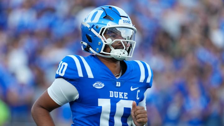 Aug 28, 2025; Durham, North Carolina, USA;  Duke Blue Devils quarterback Darian Mensah (10) comes running out onto the field before the start of the game against the Elon Phoenix at Wallace Wade Stadium. Mandatory Credit: James Guillory-Imagn Images