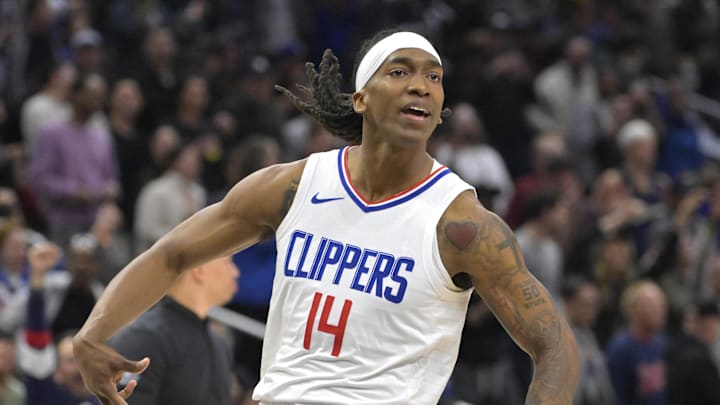 Apr 7, 2024; Los Angeles, California, USA; Los Angeles Clippers guard Terance Mann (14) celebrates after hitting a 3-point basket to tie the score in the fourth quarter against the Cleveland Cavaliers at Crypto.com Arena. 