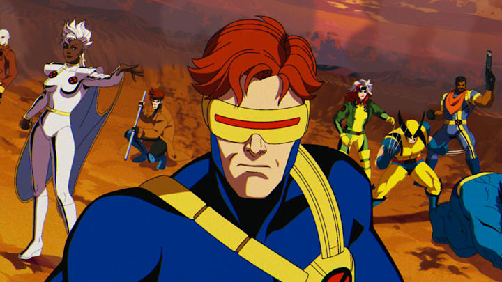(L-R): Morph (voiced by JP Karliak), Storm (voiced by Alison Sealy-Smith), Gambit (voiced by AJ LoCascio), Cyclops (voiced by Ray Chase), Rogue (voiced by Lenore Zann), Wolverine (voiced by Cal Dodd), Bishop (voiced by Isaac Robinson-Smith), Beast (voiced by George Buza) in Marvel Animation's X-MEN '97. Photo courtesy of Marvel Animation. © 2024 MARVEL.