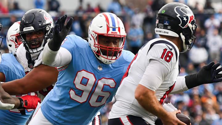 Dec 17, 2023; Nashville, Tennessee, USA; Houston Texans quarterback Case Keenum (18) is sacked by Tennessee Titans defensive end Denico Autry (96) during the second half at Nissan Stadium. Mandatory Credit: Christopher Hanewinckel-USA TODAY Sports Dec 17, 2023; Nashville, Tennessee, USA; Houston Texans quarterback Case Keenum (18) is sacked by Tennessee Titans defensive end Denico Autry (96) during the second half at Nissan Stadium. Mandatory Credit: Christopher Hanewinckel-USA TODAY Sports