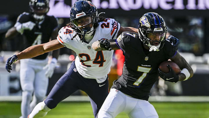 Oct 26, 2025; Baltimore, Maryland, USA;  Baltimore Ravens wide receiver Rashod Bateman (7) rubs after the catch as Chicago Bears cornerback Nick McCloud (24) defends  during the game at M&T Bank Stadium.