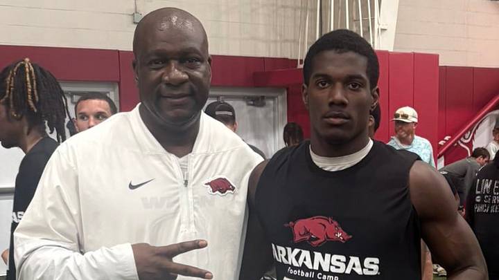 Arkansas Razorbacks running back coach David "YAC" Johnson (left) with Bryant sophomore running back Tavian Morris (right) during the program's prospect camp Sunday, June 14, 2026. Arkansas Razorbacks running back coach David "YAC" Johnson (left) with Bryant sophomore running back Tavian Morris (right) during the program's prospect camp Sunday, June 14, 2026.