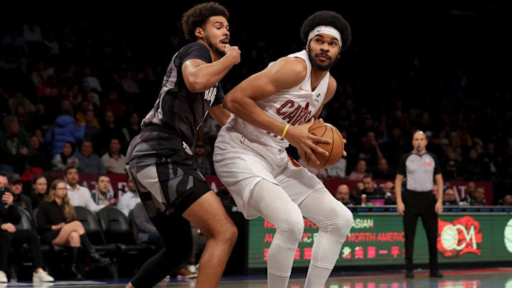 Dec 16, 2024; Brooklyn, New York, USA; Cleveland Cavaliers center Jarrett Allen (31) controls the ball against Brooklyn Nets forward Cameron Johnson (2) during the first quarter at Barclays Center. Mandatory Credit: Brad Penner-Imagn Images