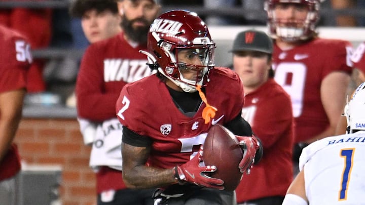 Sep 20, 2024; Pullman, Washington, USA; Washington State Cougars wide receiver Kyle Williams (2) makes a catch against San Jose State Spartans safety Robert Rahimi (1) in the second half at Gesa Field at Martin Stadium. Mandatory Credit: James Snook-Imagn Images