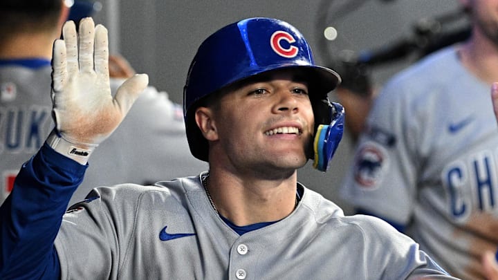 jAug 13, 2025; Toronto, Ontario, CAN;  Chicago Cubs third baseman Matt Shaw (8) celebrates with team mates in the dugout after hitting a solo home run against the Toronto Blue Jays in the fifth inning at Rogers Centre. Mandatory Credit: Dan Hamilton-Imagn Images
