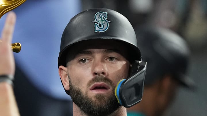 Seattle Mariners right fielder Mitch Haniger (17) holds a pitchfork after hitting a home run in the ninth inning against the Los Angeles Dodgers at Dodger Stadium in 2024. Seattle Mariners right fielder Mitch Haniger (17) holds a pitchfork after hitting a home run in the ninth inning against the Los Angeles Dodgers at Dodger Stadium in 2024.