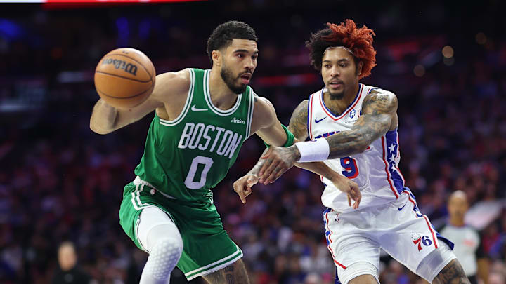Apr 30, 2026; Philadelphia, Pennsylvania, USA; Boston Celtics forward Jayson Tatum (0) controls the ball against Philadelphia 76ers guard Kelly Oubre Jr. (9) during the second quarter at Xfinity Mobile Arena. Mandatory Credit: Bill Streicher-Imagn Images