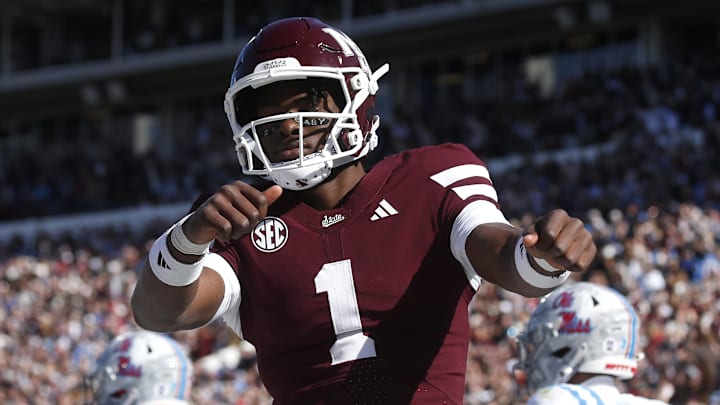 Mississippi State Bulldogs quarterback Kamario Taylor (1) celebrates after scoring a touchdown against the Mississippi Rebels in the first half at Davis Wade Stadium at Scott Field.